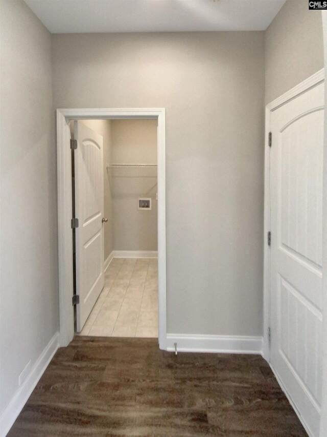 corridor featuring wood-type flooring