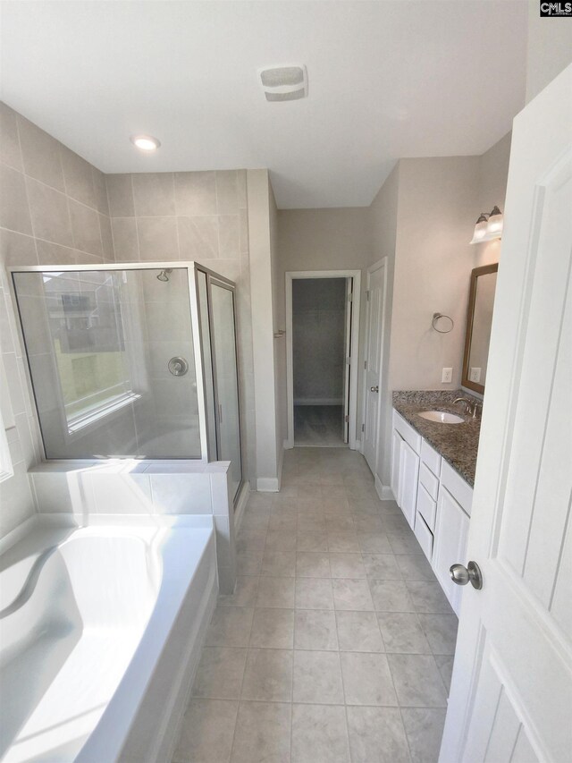 bathroom with vanity, separate shower and tub, and tile patterned floors