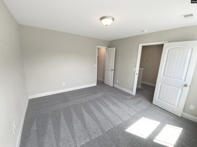 unfurnished bedroom featuring carpet flooring