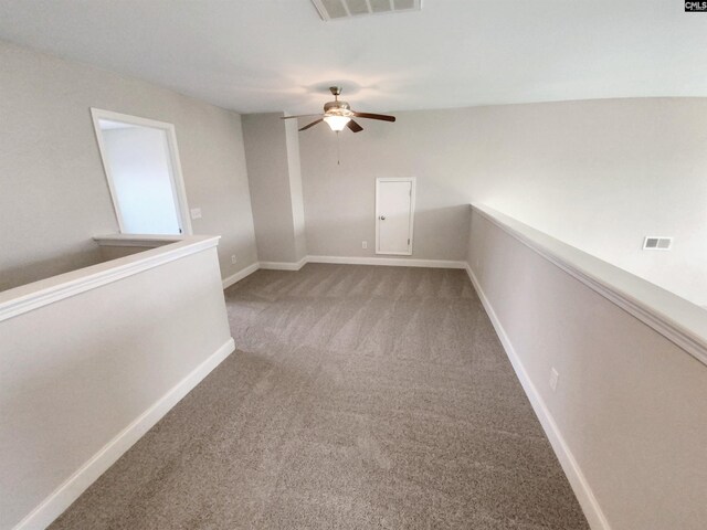 carpeted empty room with ceiling fan