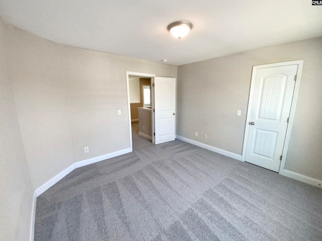 unfurnished bedroom with carpet floors