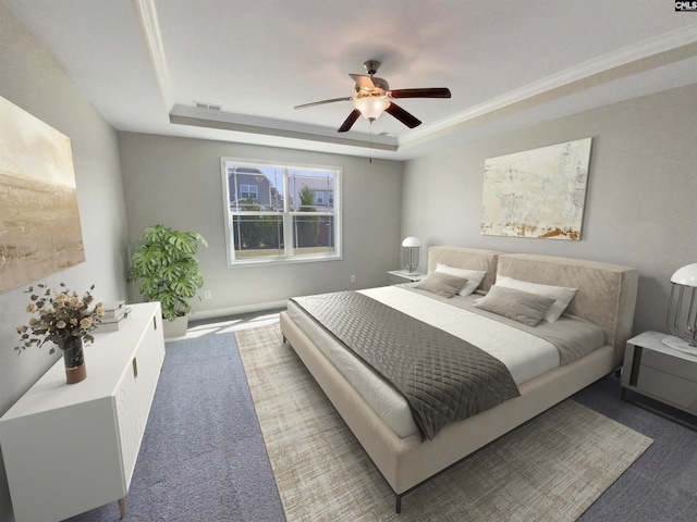 bedroom with a raised ceiling, ceiling fan, and carpet floors