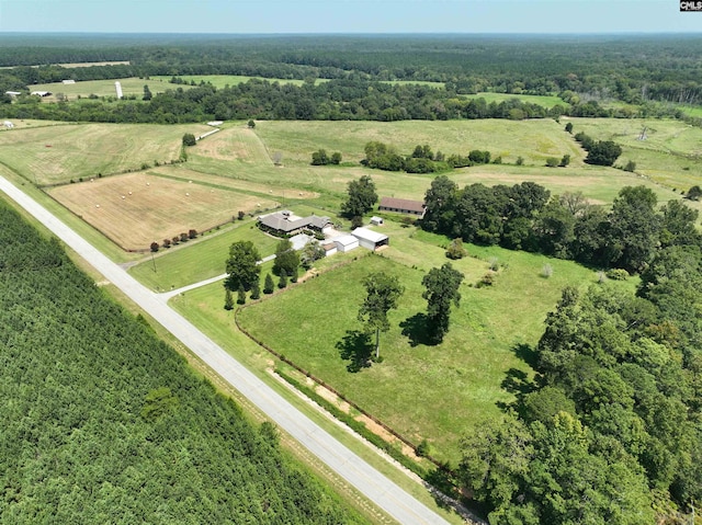 birds eye view of property featuring a rural view