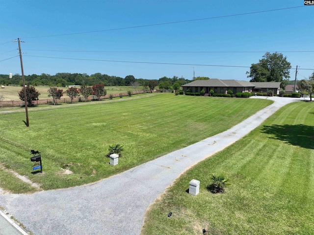 view of yard with a rural view