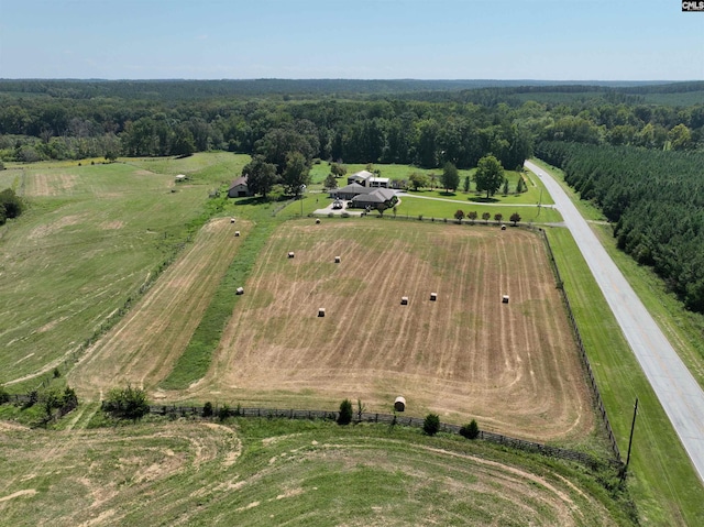 birds eye view of property with a rural view