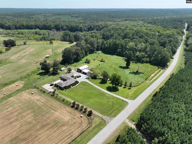 aerial view featuring a rural view and a forest view
