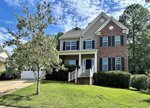 view of front of property with a garage and a front lawn