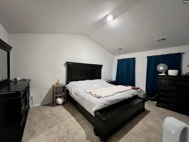 carpeted bedroom featuring lofted ceiling