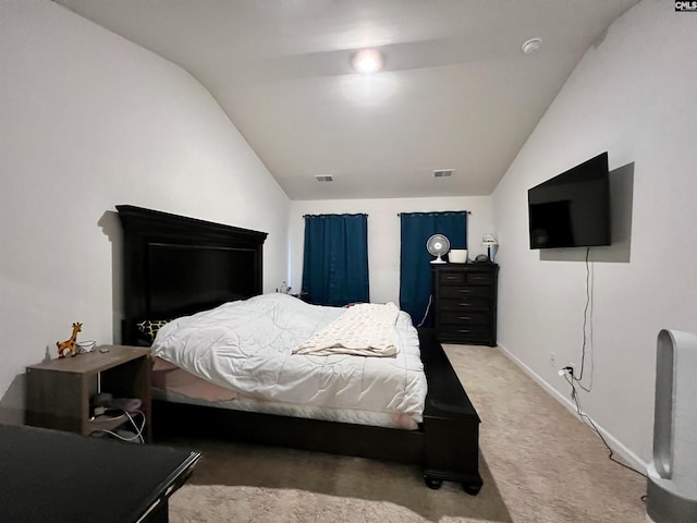 bedroom with lofted ceiling and carpet