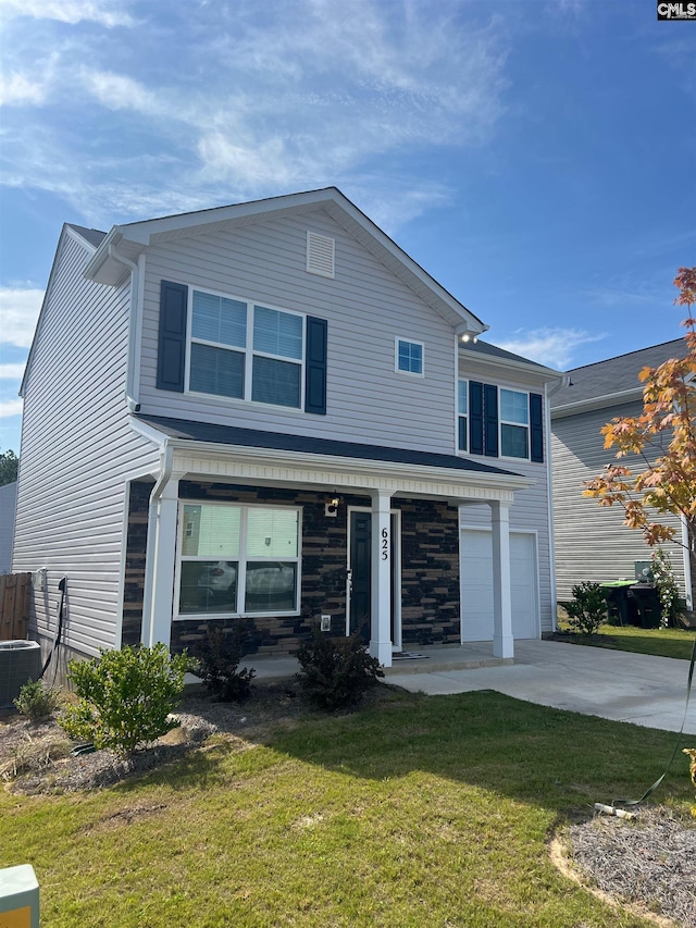 view of front of home featuring cooling unit, a garage, and a front yard