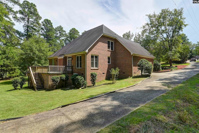 view of property exterior featuring a yard and a wooden deck