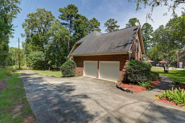 view of side of home featuring a yard