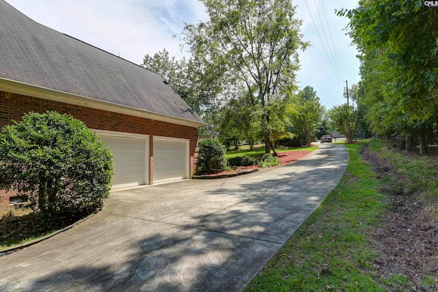 view of side of property with a garage