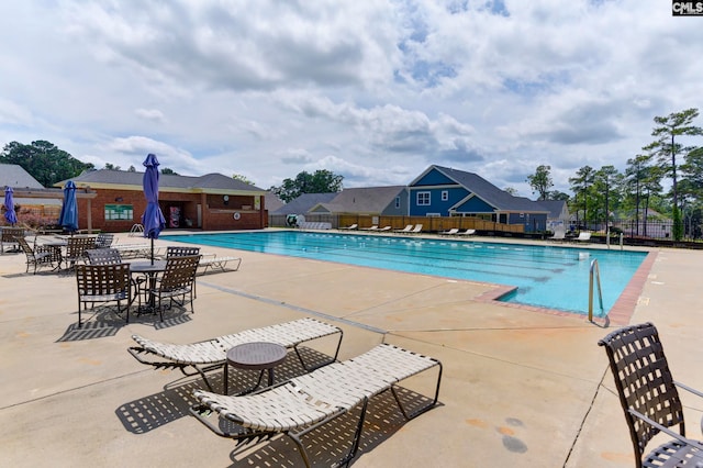 view of swimming pool with a patio area