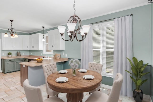 dining room featuring an inviting chandelier and crown molding