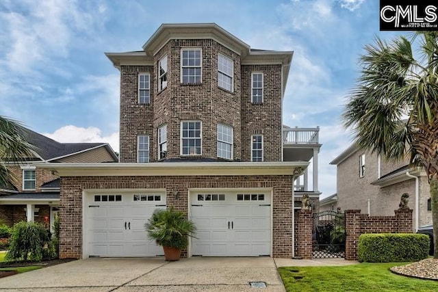 view of front of property featuring a balcony and a garage