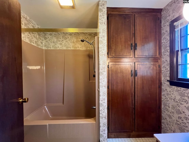 full bath with shower / washtub combination, visible vents, and wallpapered walls