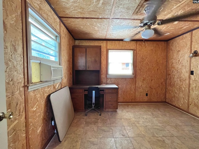 unfurnished office featuring cooling unit and a ceiling fan