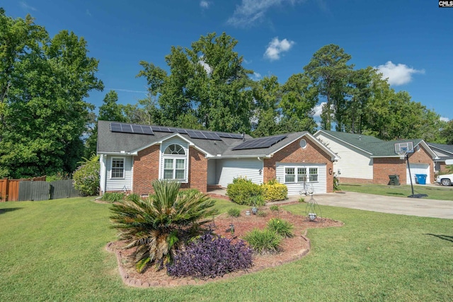 ranch-style home featuring solar panels and a front lawn