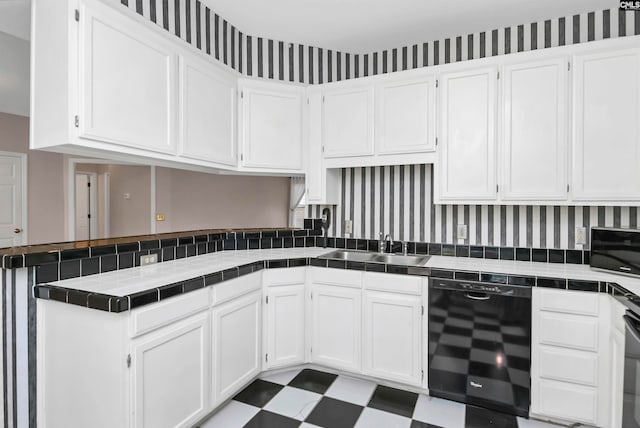 kitchen with dishwasher, tile countertops, and white cabinets