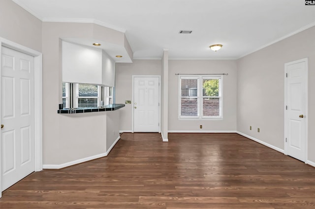 kitchen featuring ornamental molding and dark hardwood / wood-style flooring