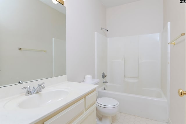 full bathroom featuring washtub / shower combination, tile patterned flooring, toilet, and vanity