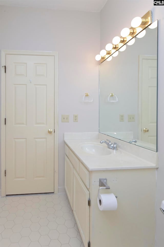 bathroom with tile patterned floors and vanity