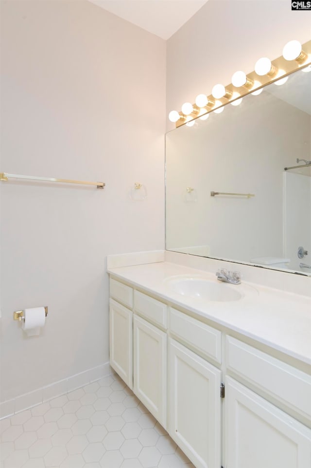 bathroom featuring tile patterned flooring and vanity