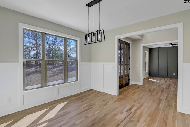 unfurnished dining area with light wood-type flooring