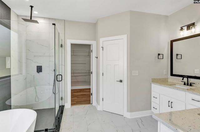 bathroom featuring an enclosed shower and vanity