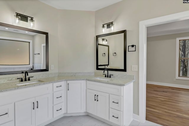 bathroom featuring vanity and hardwood / wood-style flooring