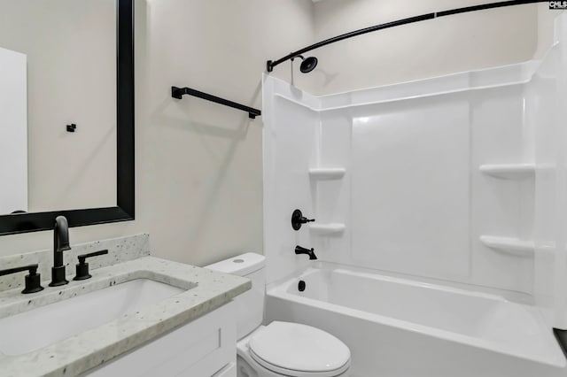 full bathroom with vanity, toilet, and washtub / shower combination