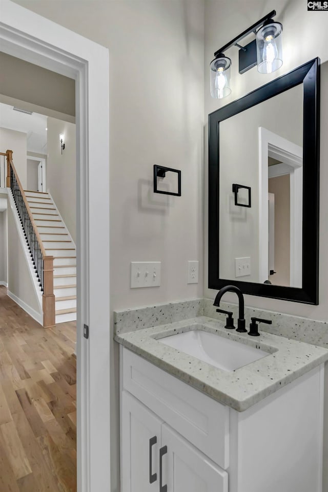 bathroom featuring wood-type flooring and vanity