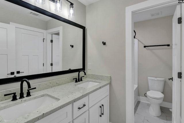 full bathroom featuring shower / tub combination, vanity, and toilet