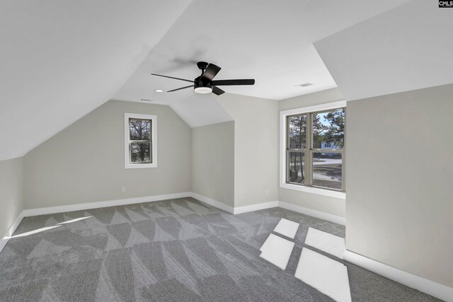 additional living space with lofted ceiling, ceiling fan, and carpet floors