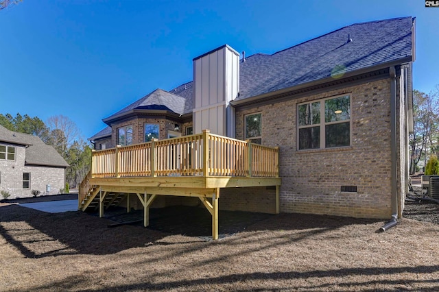 back of house with cooling unit and a deck