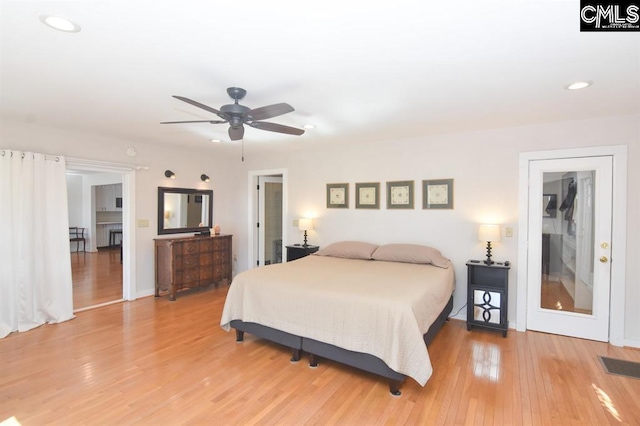 bedroom featuring light wood-type flooring and ceiling fan