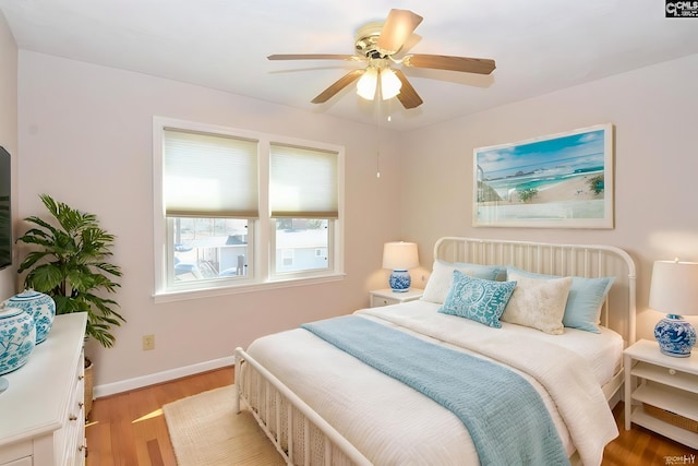 bedroom with ceiling fan and light wood-type flooring