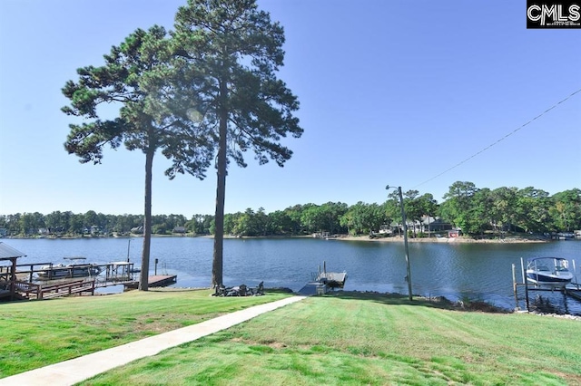 view of dock featuring a yard and a water view