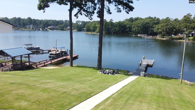 dock area featuring a lawn and a water view