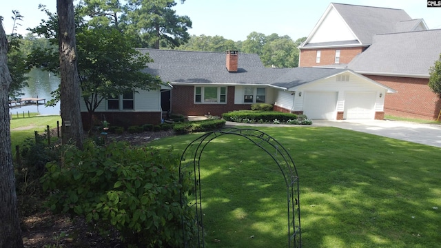 view of front of house with a garage and a front yard