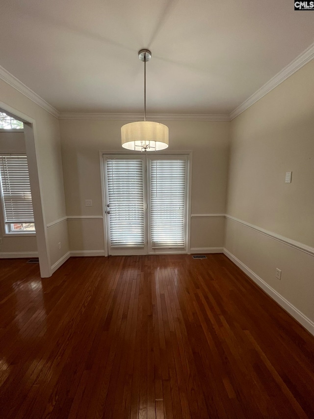 interior space featuring crown molding and dark wood-type flooring