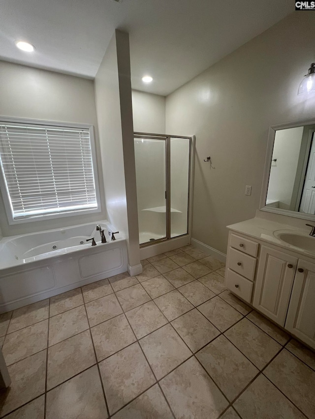 bathroom featuring tile patterned floors, shower with separate bathtub, and vanity