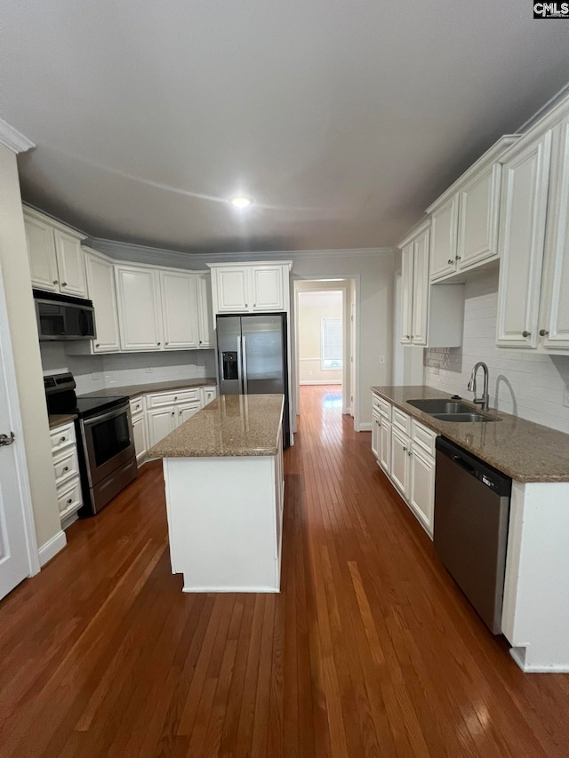 kitchen featuring white cabinets, appliances with stainless steel finishes, sink, and dark wood-type flooring