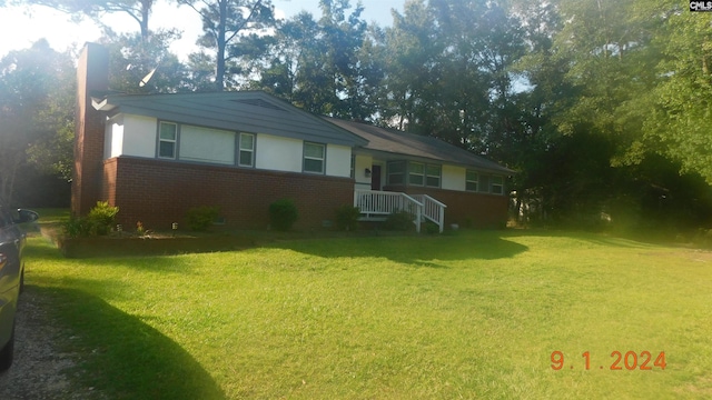 view of front of home with a front yard