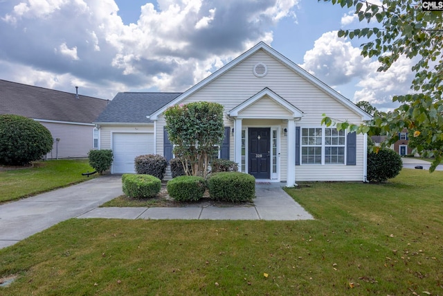 view of front of home with a garage and a front lawn