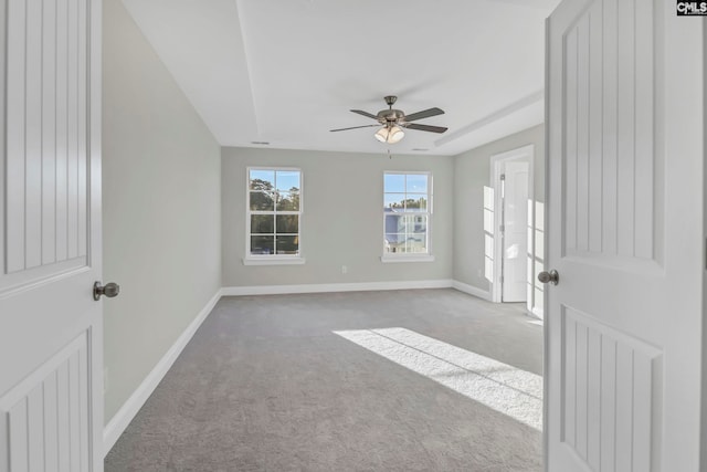 empty room with ceiling fan and carpet