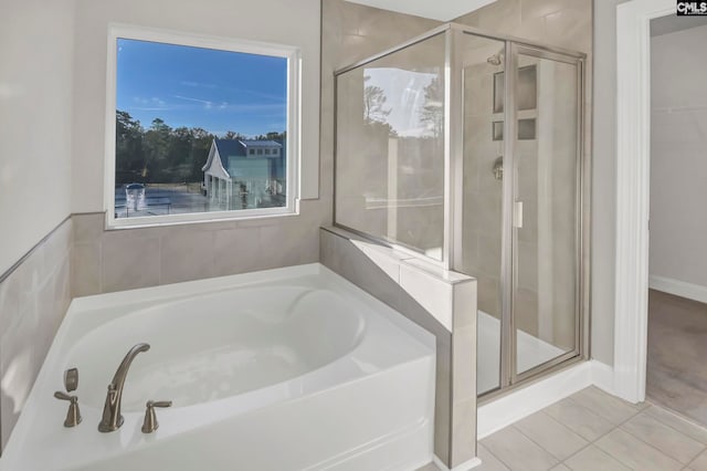 bathroom featuring separate shower and tub and tile patterned floors