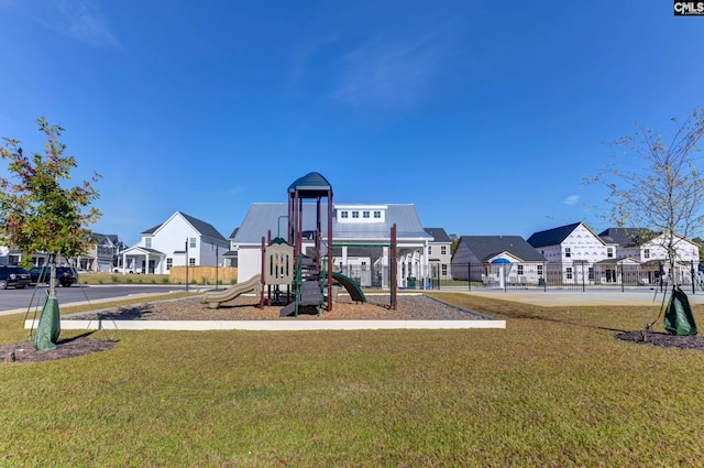 view of jungle gym with a lawn