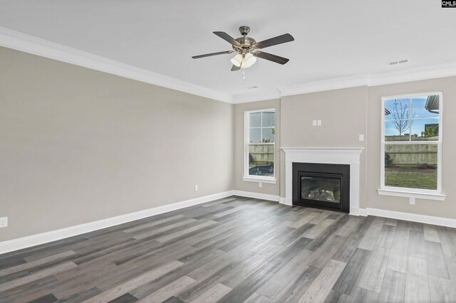 unfurnished living room with ornamental molding, hardwood / wood-style flooring, and ceiling fan